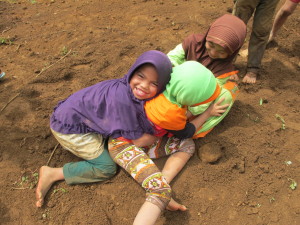 Local kids play in the dirt